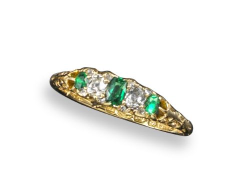 A late Victorian small emerald and diamond half hoop ring, set with three emeralds and two cushion-shaped diamonds in 18ct ye