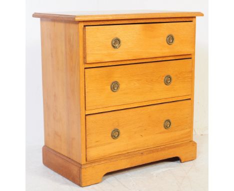 An Edwardian ash / oak wood Arts & Crafts cottage chest of drawers. The chest with stunning brass handles and back plates. 2 
