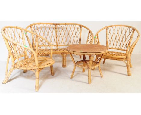 A retro 20th century bamboo and cane suite. The set comprising a two seater sofa, two armchairs and a small coffee table. Eac