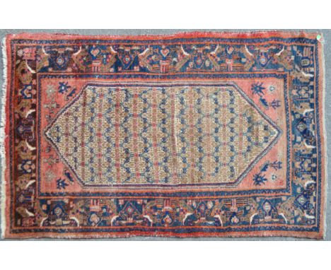 A 20th century Persian Islamic carpet floor rug. Having polychrome design, with a large hexagonal geometric central medallion