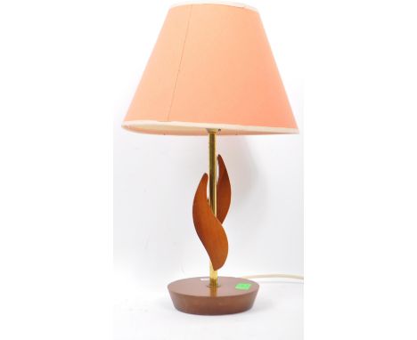 Mid century Danish inspired teak table lamp with a golden brass stem and teak leaf details raised upon a circular teak base, 