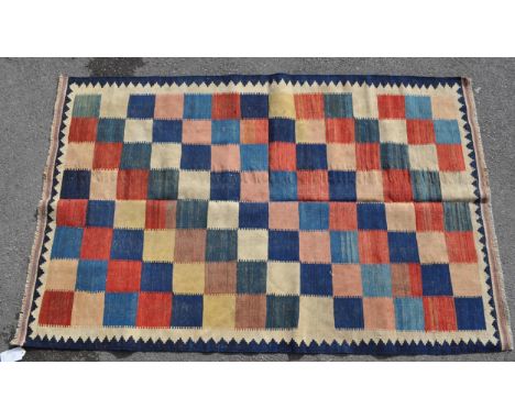 A 20th century south west Persian Qashgai / Kashgai Kilim carpet floor rug. Having a cream ground with undulating blue outer 