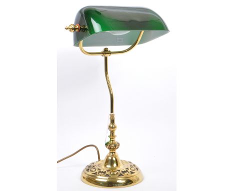 A vintage 20th century 1920's style brass and glass bankers lamp. The lamp having a green cased glass shade over hooked brass