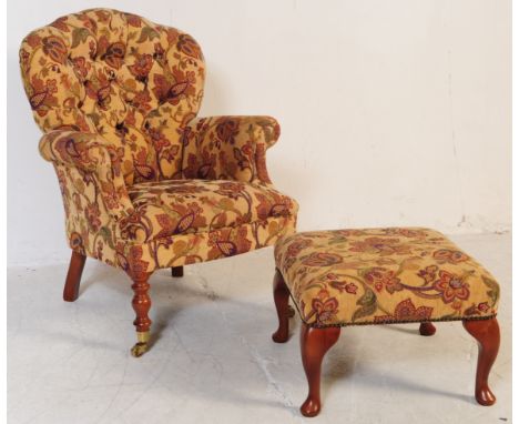 Victorian style mahogany leg upholstered button backed Chesterfield style armchair. Raised on mahogany legs with brass castor