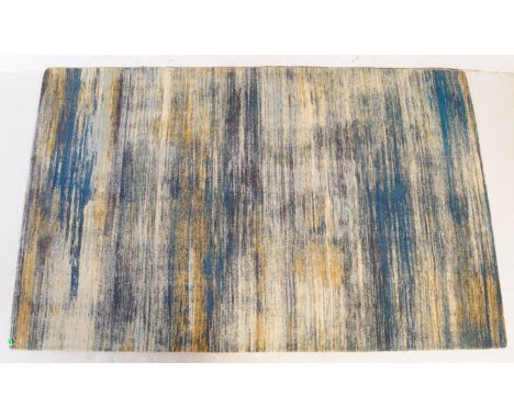 A large contemporary 'Verve' carpet floor rug by John Lewis. Of rectangular form with tones of yellow, grey and cyan blue - '