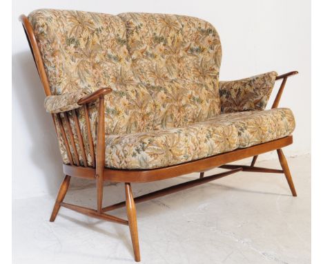 Ercol - Model 1913 - Evergreen - A mid 20th century circa 1960s blond elm Ercol Evergreen sofa settee. Having spindle back ov