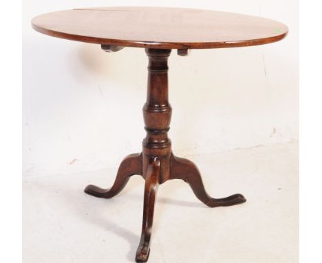Ipswich Oak Jacobean revival tilt top pedestal dining table being raised on splayed legs with tripod base and turned column, 