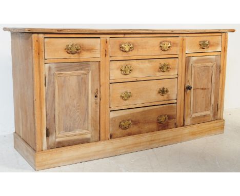 A Victorian 19th century pine dresser sideboard. Of small proportions being raised on bracket feet having a configuration of 