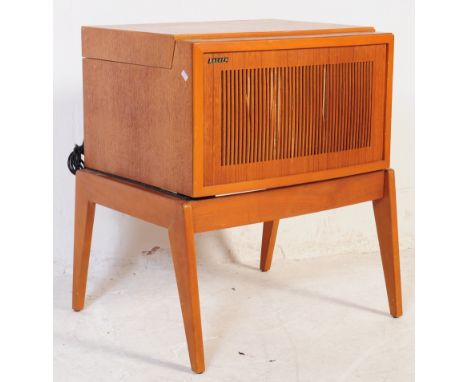 A vintage mid 20th century Hacker turntable record player. Rectangular form teak veneered case with pierced front, hinged lid