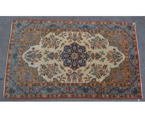 A vintage 20th century north west Persian Islamic Tabriz carpet floor rug. Having a central flora medallion, encapsulated in 