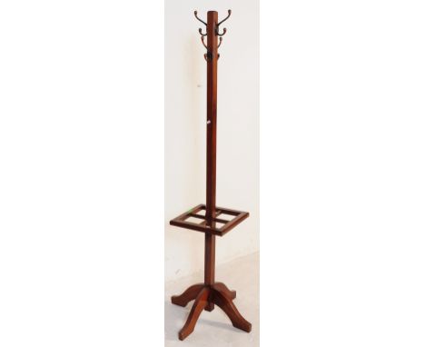 British Modern Design - Mid-century teak wood hall coat stand. Raised on four-point base with hooks atop. Stick stand quadran