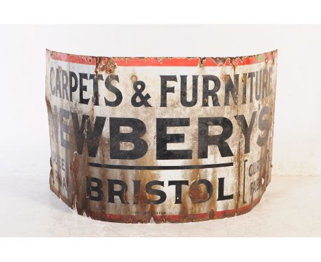 An early 20th century enamel shop advertising sign for Newbery's of Bristol - Furniture Carpets Curtains - Queens Road, Brist