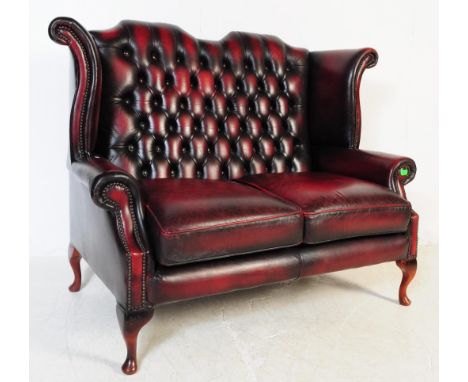 &nbsp;Chesterfield button back two seater leather sofa / settee / couch. Having curved elbow / back rest with drop in rectang