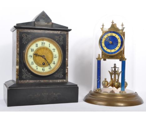 A 19th century slate French 24 hour mantel clock. Having stone inlay, with decorative carvings supported on a plinth base. Wh