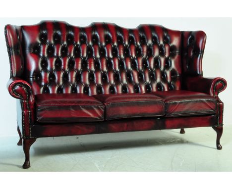 &nbsp;Queen Anne wingback / Chesterfield style button back three seater leather sofa / settee / couch. Having curved elbow / 