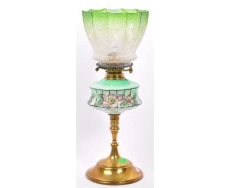 A Victorian 19th century brass oil lamp. The brass oil with glass reservoir, flue and frosted acid etched shade in green and 