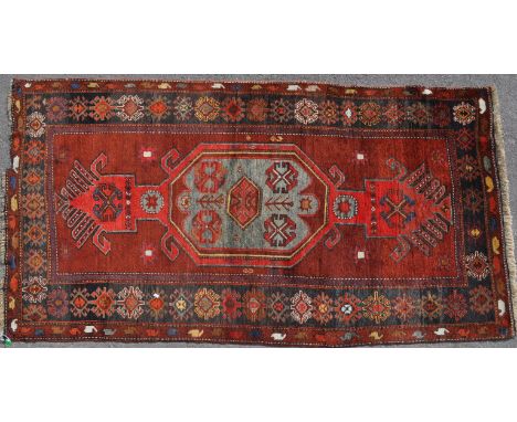 A 20th century Edler Kazakh / Kazak carpet floor rug. Featuring a central medallion, flanked by geometric patterning encapsul