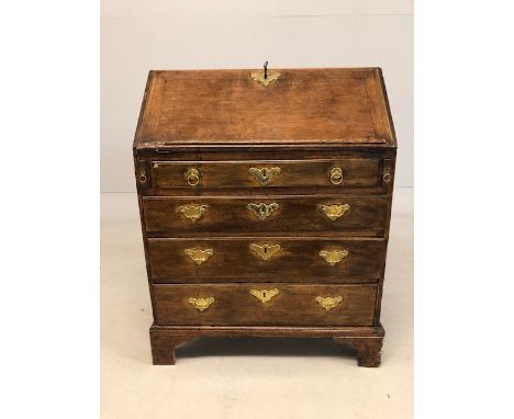 Small sized Oak Bureau with fall front to pigeon holes and drawers, brass fitments and key