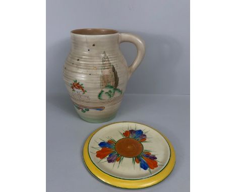 Clarice Cliff ribbed Clovelly jug approximately 20cm high (hairline crack to neck) and a Crocus Bizarre dish plate approximat