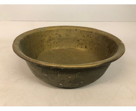 Antique early 19th century brass washing basin, dark patination to outside, approximately 59cm diameter