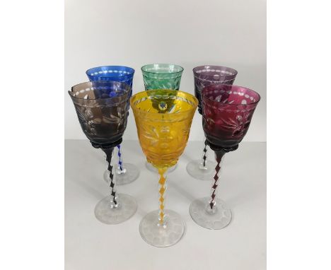 Antique glassware, set of six Bohemian wheel cut crystal wine glasses, each of a different colour with same cut design and in