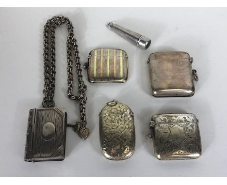 Antique Vesta cases, two English hallmarked silver vesta cases, two EPNS vesta cases, a book shaped vesta and stamp case on a