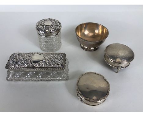 Silver items to include two silver lidded glass dressing table pots, a silver pin dish, and two silver lidded pin dishes (5)