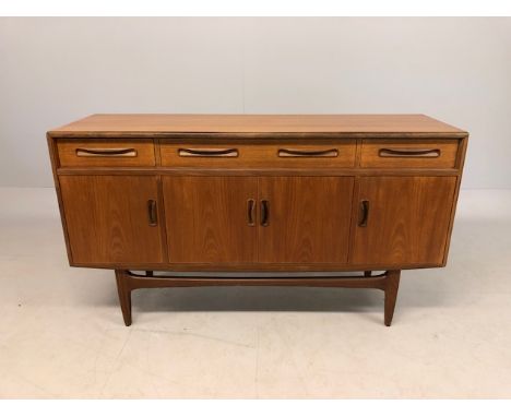 G-Plan Fresco Teak sideboard with three drawers including central cutlery draw over cupboards all with rolled teak handles ra