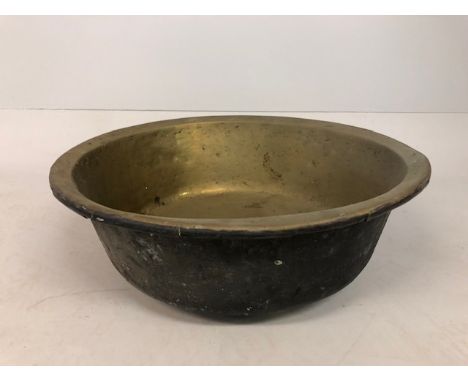 Antique early 19th century brass washing basin, dark patination to outside, approximately 63cm diameter