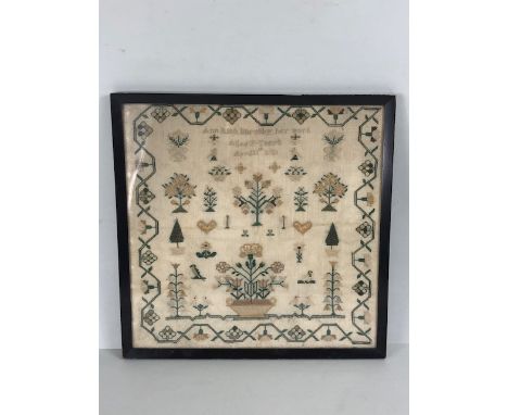 Framed Victorian sampler by Ann Rich Barnaby aged 7 years and dated April 11th 1831 depicting flowers and birds approx 32 x 3