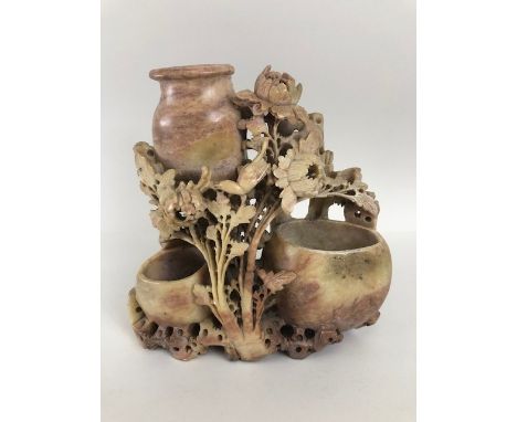 Chinese soap stone carving of three water vessels surrounded by flowers and birds approximately 19cm high