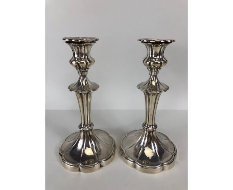 Pair of Hallmarked weighted candlesticks by Mappin & Webb on flared bases with matching collars approx 22cm tall