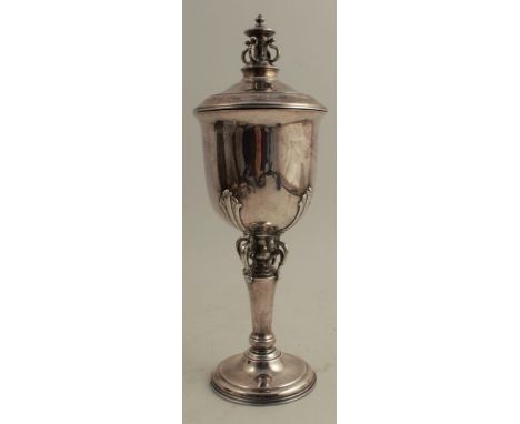 A silver standing covered cup, the column and finial decorated with pierced scrolls, Birmingham 1937, maker Adie Brothers Ltd