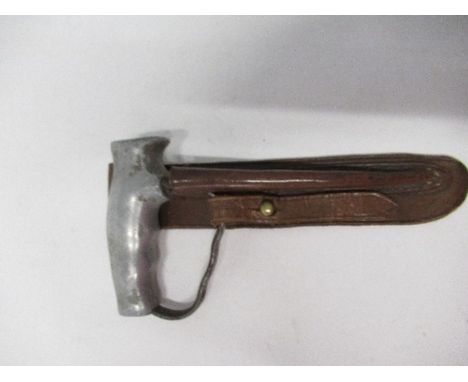 A World War I trench dagger, by Robbins of Dudley, with alloy style pistol grip, together with a tan leather scabbard