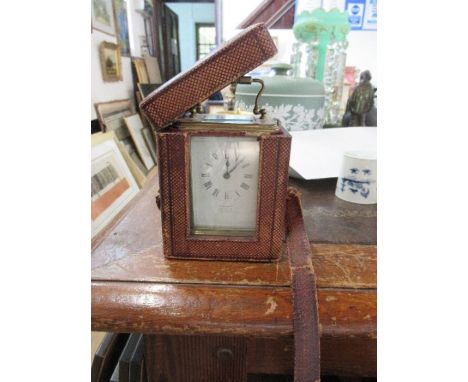 A brass carriage clock, Martin and Co, Cheltenham, Made in Paris, with case and key