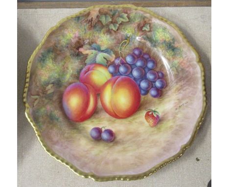 A Royal Worcester cabinet plate, decorated with fruit to a mossy background by H Aryton, with gilt shaped edge, diameter 10.5