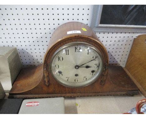 An oak cased mantel clock, height 10ins
