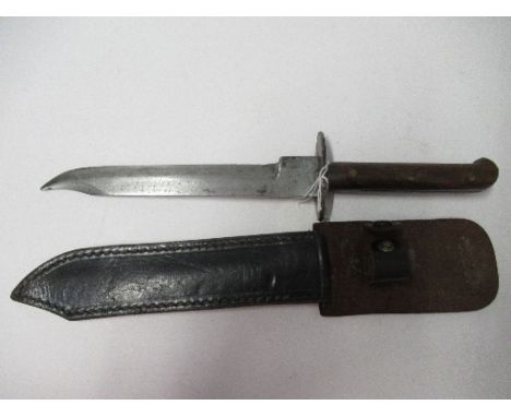 A steel bladed dagger, or knife, with shaped single sided blade, and wooden handle, blade length 7.75ins, together with leath