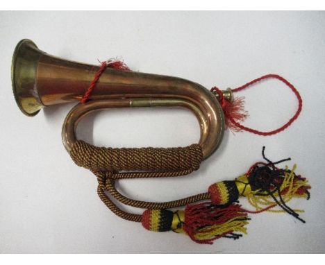 A bugle, with black red and yellow tassels