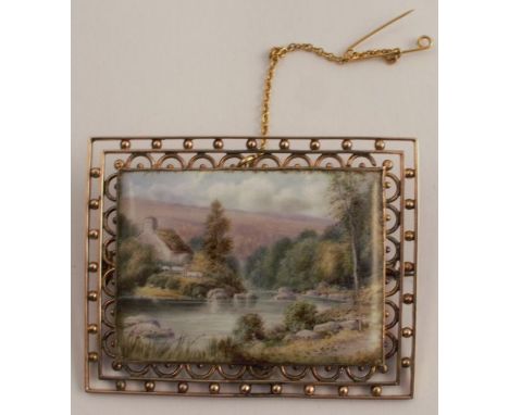 An enamel landscape panel, to an unmarked bead and wire frame, 5.3cm x 4.2cm