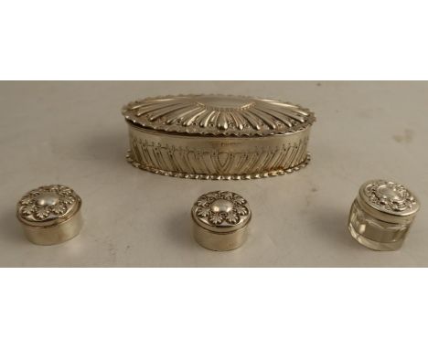 A Victorian silver oval covered box, together with two silver patch boxes, and another