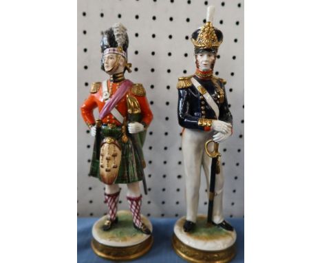 A continental model of a Royal Artillery soldier, together with another soldier in Highland dress (92nd Root)