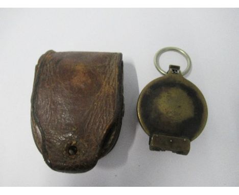 A German marching compass, stamped Busch, together with another marching compass, stamped The Reflector Compass, Junior Army 