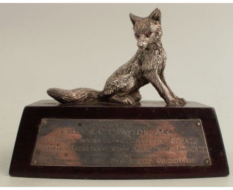 A silver model, of a seated fox, on base with silver presentation plaque, London 1965, height 4ins