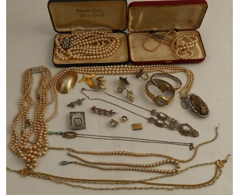 A four row simulated pearl necklace, to a sterling silver clasp, cased, together with four other simulated pearl necklaces, a