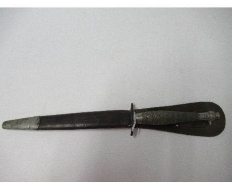 A World War II Fairbairn Sykes style Commando dagger, together with sheath, with blade by Wilkinson