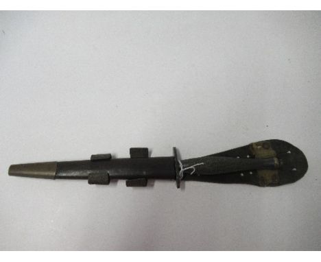 A World War II Fairbairn Sykes style Commando dagger, together with sheath, with blade by Wilkinson marked Earl E Kieffer