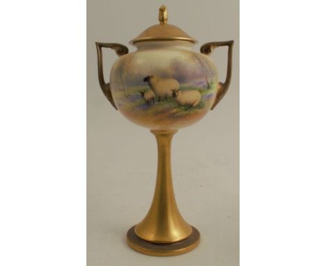 A Royal Worcester covered vase on a pedestal, decorated with sheep in a bluebell wood by Barker, shape number 2736, circa 193