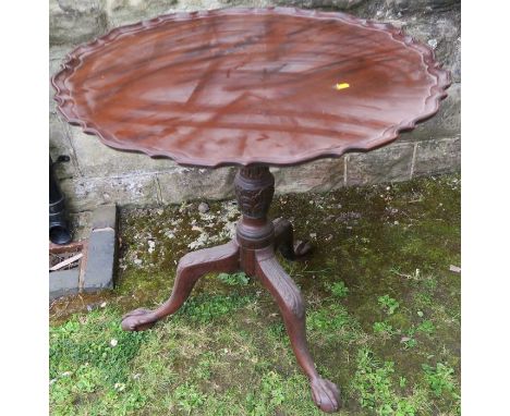 A Georgian design mahogany pie crust top occasional table, raised on a tripod base