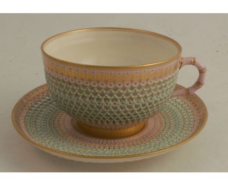 A Royal Worcester reticulated tea cup and saucer, in the manner of George Owen, with gilt decoration - PLEASE NOTE AMENDED CO
